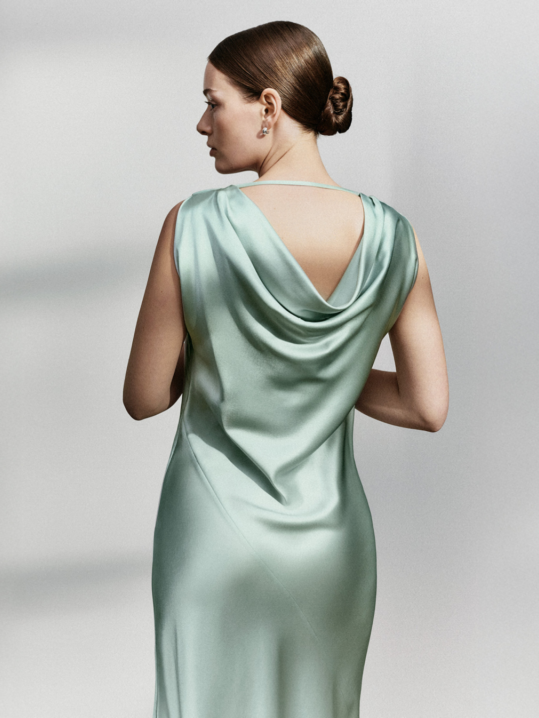 woman in black satin suit